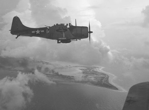 SBD_Dive_Bomber_over_Wake_Island,_1943